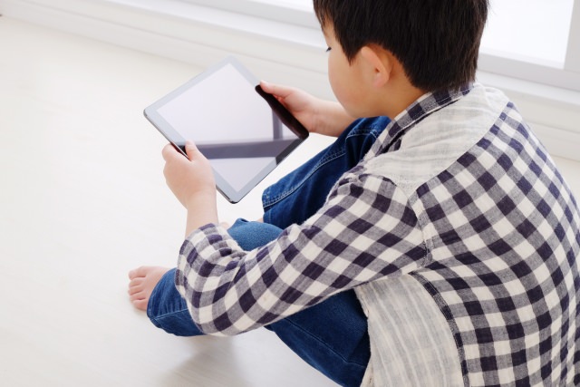 A child having a tablet